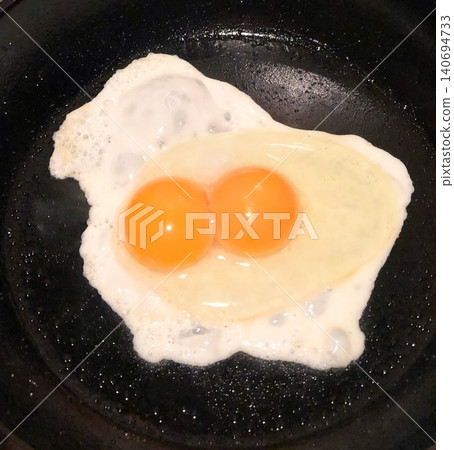 A stroke of luck while making breakfast (a fried egg with two yolks) A stroke of luck while making breakfast (a fried egg with two yolks) 140694733