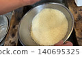 Washed white rice in a bowl 140695325