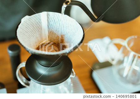 Barista making drip coffee. 140695801