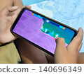 portrait of a child playing games on a smartphone 140696349