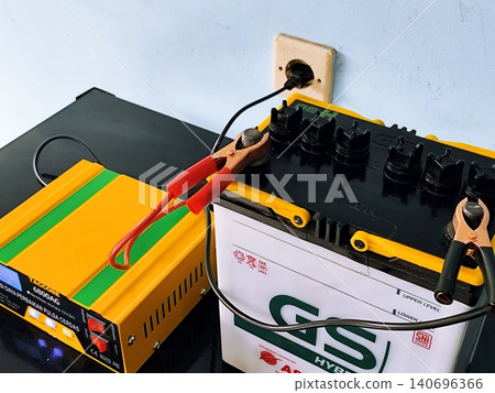 car battery being charged on the table in yogyakarta March 09,2025 car battery being charged on the table in yogyakarta March 09,2025 140696366