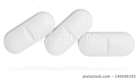 Different pills in row isolated on white. White medicine tablet, clearly depicting shape and the distinct central score line for easy division. 140696393