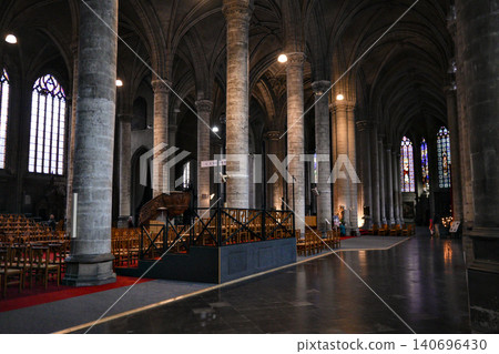 Gothic Cathedral Nave With Stone Columns Pews and Temporary Exhibition Display 140696430