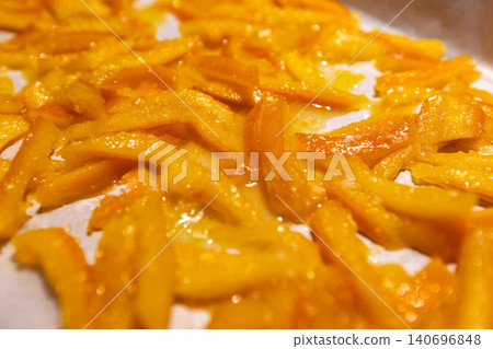 Top view of homemade candied orange peels drying Top view of homemade candied orange peels drying 140696848