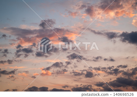 Bright colourful clouds in sky just after sunset during blue hour. Vibrant clouds in sky, calm majestic evening Bright colourful clouds in sky just after sunset during blue hour. Vibrant clouds in sky, calm majestic evening 140698526
