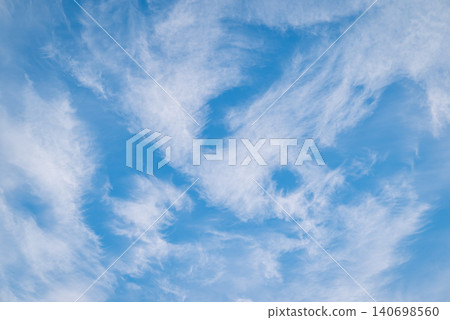 Landscape of clouds in blue sky. Abstract clouds in different shapes melting in sky Landscape of clouds in blue sky. Abstract clouds in different shapes melting in sky 140698560
