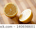 Lemon cut in two halves, close up. Fresh citrus laying on the table, yellow fruit, vitamins, good for health concept 140698601