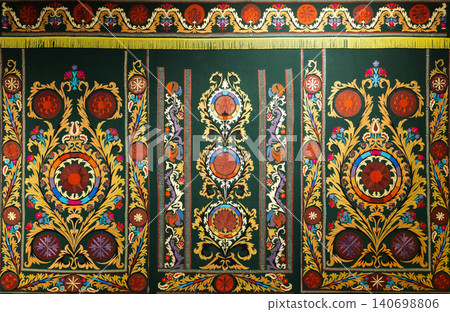 Luxurious ornate embroidered tapestry featuring symmetrical floral medallions Luxurious ornate embroidered tapestry featuring symmetrical floral medallions 140698806