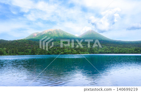 Mount Meakan and Mount Akan Fuji as seen from Lake Onneto in Ashoro Town, Hokkaido, during the summer. Mount Meakan and Mount Akan Fuji as seen from Lake Onneto in Ashoro Town, Hokkaido, during the summer. 140699219