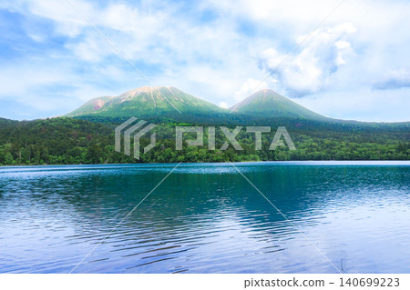 Mount Meakan and Mount Akan Fuji as seen from Lake Onneto in Ashoro Town, Hokkaido, during the summer. Mount Meakan and Mount Akan Fuji as seen from Lake Onneto in Ashoro Town, Hokkaido, during the summer. 140699223