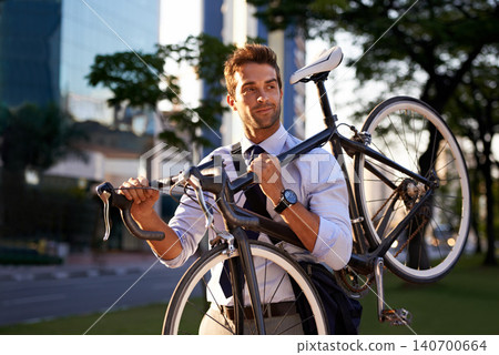 Morning, businessman and bicycle for sustainable travel, transportation and carbon footprint in city. Professional, commute and male employee walking with bike for cycling, journey or eco friendly Morning, businessman and bicycle for sustainable travel, transportation and carbon footprint in city. Professional, commute and male employee walking with bike for cycling, journey or eco friendly 140700664