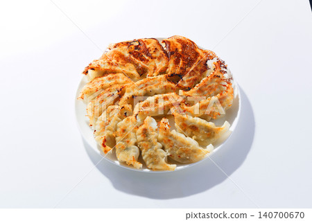 Delicious looking roasted dumplings Delicious looking roasted dumplings 140700670