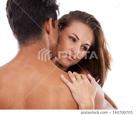 Man, woman and whisper in studio for passion or bonding, close and affection with love or care for relationship. Couple, together and sensual on white background for compassion, romance and embrace. 140700705