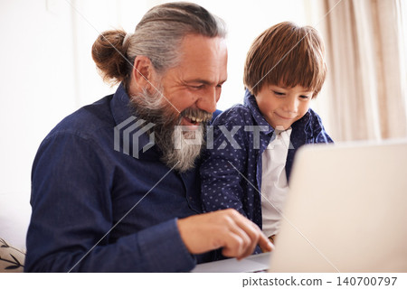 Smile, laptop and grandfather with boy and games, playing and fun in home living room. Happy, streaming or elearning online and internet in house with child, technology and computer for learning Smile, laptop and grandfather with boy and games, playing and fun in home living room. Happy, streaming or elearning online and internet in house with child, technology and computer for learning 140700797