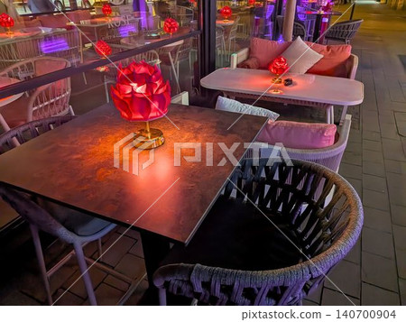 Outdoor Restaurant Terrace With Red Flower Lamps At Night Outdoor Restaurant Terrace With Red Flower Lamps At Night 140700904