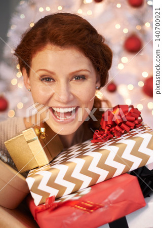 Woman, portrait and Christmas tree with present box for holiday giving with season celebration, event or packaging. Female person, face and excited for vacation break with gift, giveaway or prize Woman, portrait and Christmas tree with present box for holiday giving with season celebration, event or packaging. Female person, face and excited for vacation break with gift, giveaway or prize 140700921