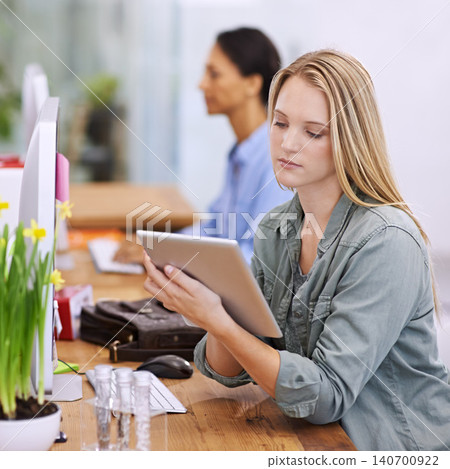 Design, planning and tablet with business woman in office for work on creative assignment or project. Desk, research and technology with confident young designer in workplace for artistic career 140700922