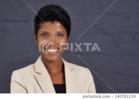 Indian woman, portrait and professional in business with smile, pride and ambition with confidence on wall background. Happy in corporate career, job satisfaction and real estate agent in Mumbai 140701230