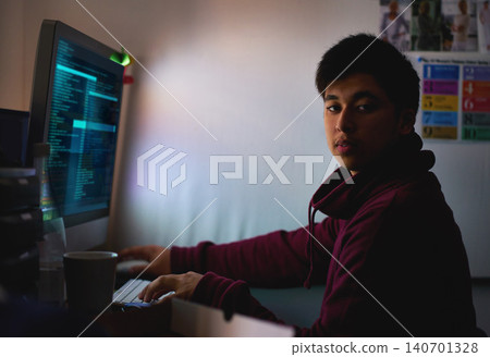 Night, portrait and man with computer for coding systems or designing software, cybersecurity and developer for company. Male person, programming or cloud engineer and malware with display of script 140701328