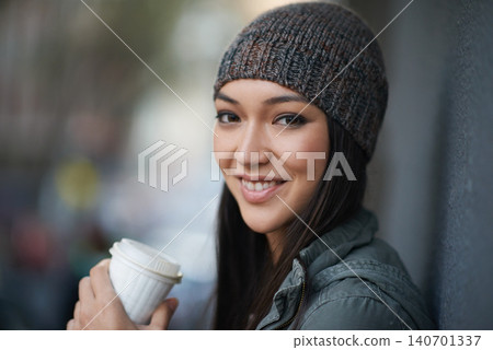 Portrait, city and smile with woman, coffee and relaxing with winter season and wool cap. Face, person and girl with tea and cappuccino with urban town and knitted beanie with happiness in a street 140701337