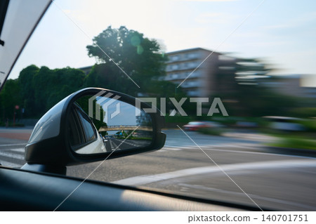 The reflection of the rearview mirror visible through the windshield The reflection of the rearview mirror visible through the windshield 140701751