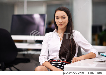 Smile, portrait and business woman in office with positive, good and confident attitude. Happy, pride and professional female designer sitting by desk for working on creative project in workplace. Smile, portrait and business woman in office with positive, good and confident attitude. Happy, pride and professional female designer sitting by desk for working on creative project in workplace. 140701883