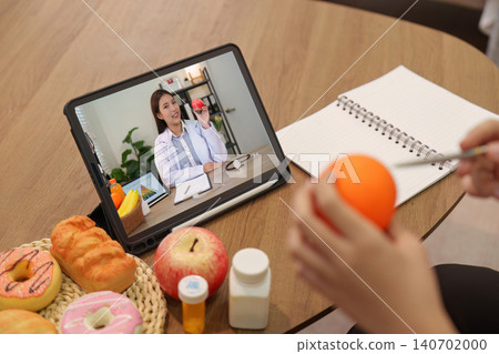 Telehealth nutrition consultation online for wellness remote healthcare with doctor on tablet patient 140702000