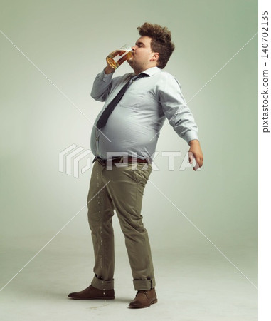 Studio, drunk and man with beer or alcohol with pint glass to drink, professional and profile. Adult, male person and guy with beverage for break, fun and crazy in party with liquid from mug Studio, drunk and man with beer or alcohol with pint glass to drink, professional and profile. Adult, male person and guy with beverage for break, fun and crazy in party with liquid from mug 140702135