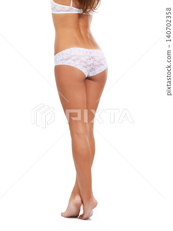 Woman, butt and legs in underwear and lingerie with confidence, pride and fashion on white background in studio. Bikini, panties and model walking or stretching in mockup space with sexy style Woman, butt and legs in underwear and lingerie with confidence, pride and fashion on white background in studio. Bikini, panties and model walking or stretching in mockup space with sexy style 140702358