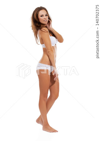 Woman, lingerie and confident with skin in studio on white background for fashion, sexy and comfortable. Portrait, female person and underwear with elegance and self esteem with lace fabric. 140702375