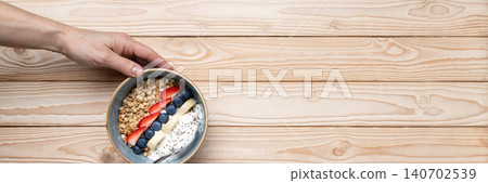 Healthy breakfast granola yogurt bowl berries Healthy breakfast granola yogurt bowl berries 140702539