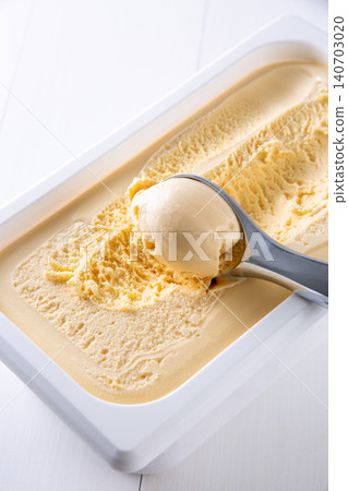 Cold vanilla ice cream scooped with an ice cream scoop Cold vanilla ice cream scooped with an ice cream scoop 140703020