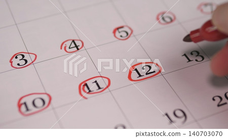 Hand Circling Consecutive Dates On Calendar To Mark Recurring Sessions, CloseUp Rows Of Red Rings, Planning For Workshop Series Or Course Schedule, Organized And Methodical Tone Hand Circling Consecutive Dates On Calendar To Mark Recurring Sessions, CloseUp Rows Of Red Rings, Planning For Workshop Series Or Course Schedule, Organized And Methodical Tone 140703070