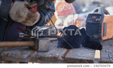 Metal Cutting With Safety Equipment. Tools And Sparks In Active Metalwork Scene. Intense Industrial Scene Capturing Skilled Craftsmanship And Energetic Sparks During Metal Fabrication Metal Cutting With Safety Equipment. Tools And Sparks In Active Metalwork Scene. Intense Industrial Scene Capturing Skilled Craftsmanship And Energetic Sparks During Metal Fabrication 140703079