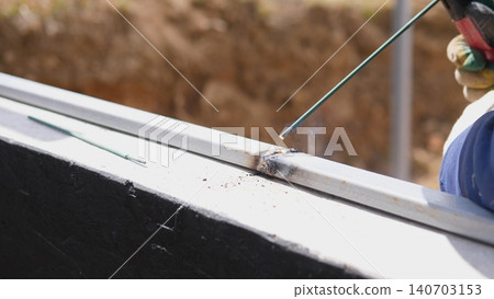 Welding Finishing Seam On Beam With Steady Torch, Gloved Hand Guiding Weld Bead Along Edge, Molten Metal Cooling Into Solid Form, Respirator And Helmet Indicate Safety Focus, Repair 140703153