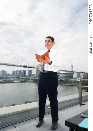 A man checking his notebook A man checking his notebook 140704268
