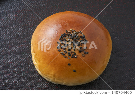 Sweet bean paste bun with black sesame seeds Sweet bean paste bun with black sesame seeds 140704400