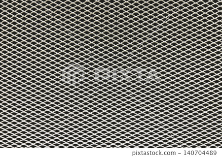 Close up of expanded metal mesh texture with geometric pattern. Industrial steel grid background for design, construction and technology concepts Close up of expanded metal mesh texture with geometric pattern. Industrial steel grid background for design, construction and technology concepts 140704489