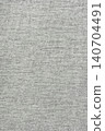 Light gray woven fabric texture with subtle textile pattern. Neutral linen background. 140704491