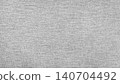 Light gray woven fabric texture with subtle textile pattern. Neutral linen background. 140704492