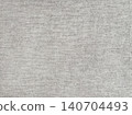 Light gray woven fabric texture with subtle textile pattern. Neutral linen background. 140704493