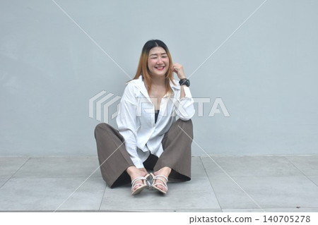 business woman posing and smiling in community mall garden 140705278