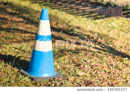 Triangular cone for construction work urging caution and regulation Triangular cone for construction work urging caution and regulation 140705377