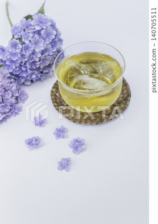A refreshing early summer tea time with hydrangeas and cold green tea. 140705511