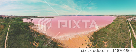 Panoramic view from above of Pink Lake in Torrevieja, Spain, Europe. Salty texture of Pink Lake. Water nature background Panoramic view from above of Pink Lake in Torrevieja, Spain, Europe. Salty texture of Pink Lake. Water nature background 140705965