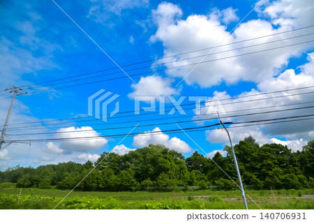 The scenery of the countryside during the roadtrip with stunning scenery of Sapporo, Hokkaido, Japan. Stunning cloudscape with beautiful landscape. Nature and Travel scene. The scenery of the countryside during the roadtrip with stunning scenery of Sapporo, Hokkaido, Japan. Stunning cloudscape with beautiful landscape. Nature and Travel scene. 140706931