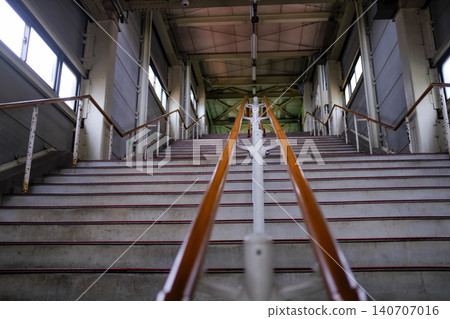 Close-up of the concrete stairs. Long stair railings in the station of Sapporo, Hokkaido, Japan. Cityscape and travel concept. 140707016