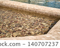 A section of a modern marble tiled jacuzzi pool.  140707237
