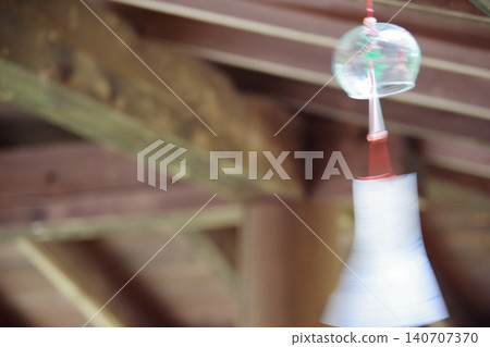 Wind chimes swaying in the wind Wind chimes swaying in the wind 140707370