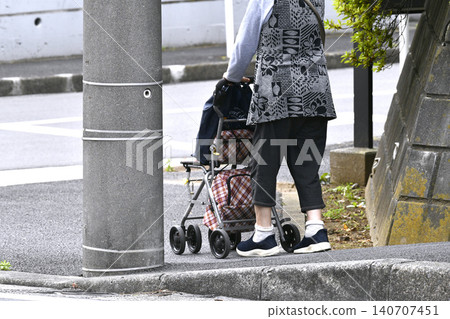 Steps in the urban landscape of Yokohama, Japan... Elderly woman using a mobility scooter... Stools are popular... Aging society... = 23rd Steps in the urban landscape of Yokohama, Japan... Elderly woman using a mobility scooter... Stools are popular... Aging society... = 23rd 140707451